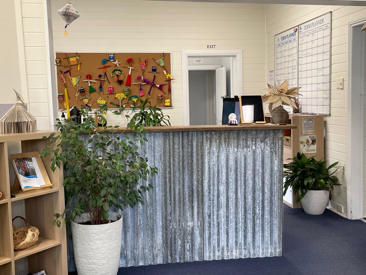 bench with corrugated iron and plants